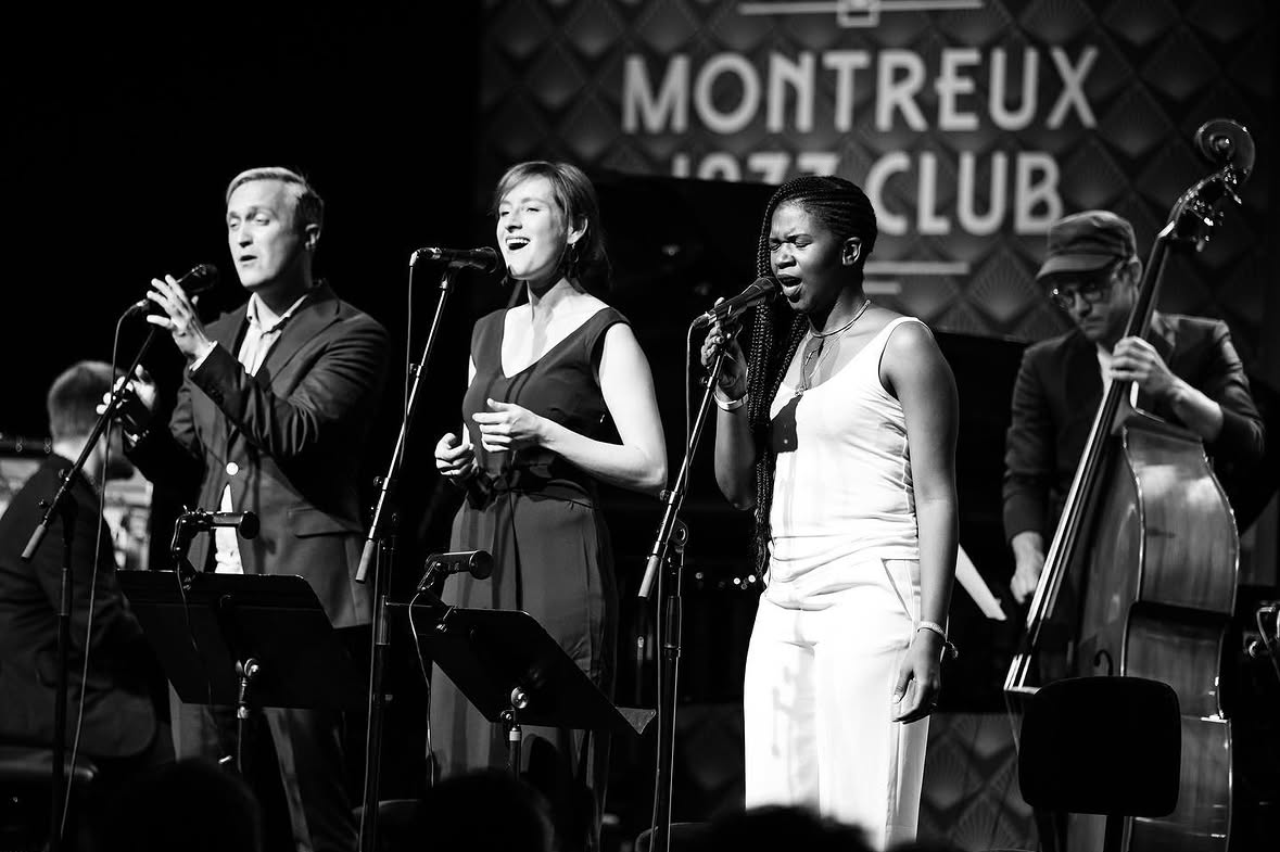 Sara Decker singing with an ensemble on stage at Montreux Jazz Club
